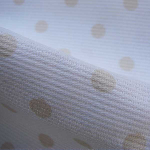 Piquet pois beige su fondo bianco